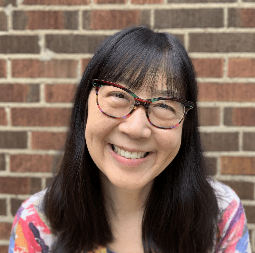 Headshot: Debbie with giant crayons - Debbie Ridpath Ohi